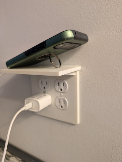 Outlet cover with shelf
