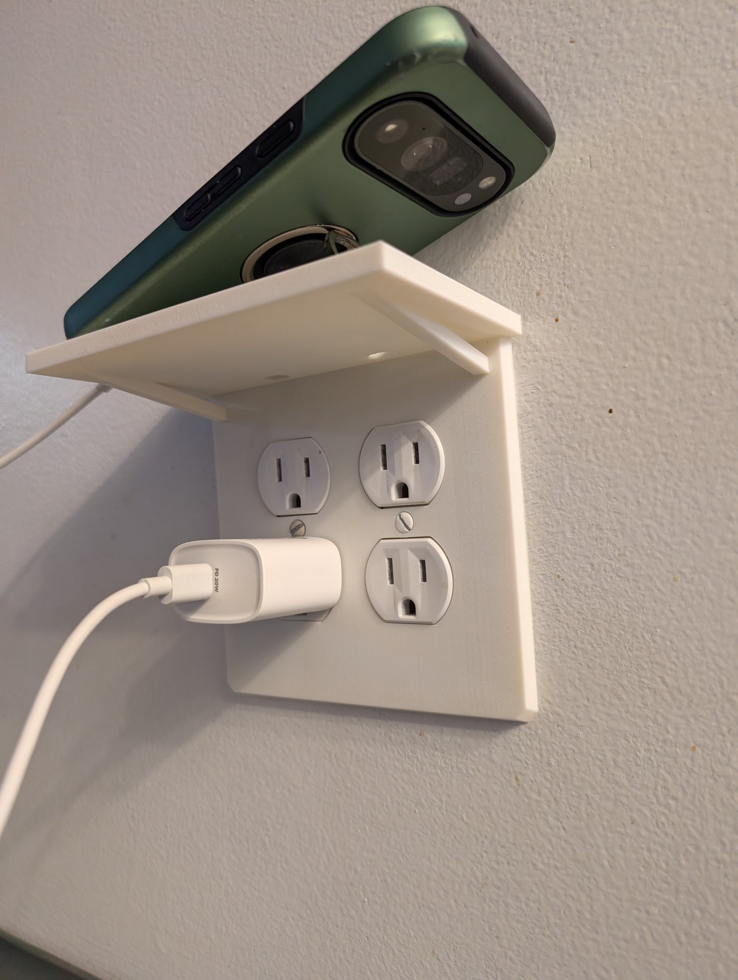 Outlet cover with shelf