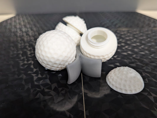 3 Gilmore golf balls with ball holder